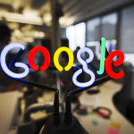 A neon Google logo is seen at the new Google office in Toronto